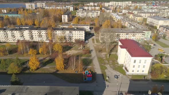 Aerial view of house of culture, alley and pond in a provincial autumn town 24 alt