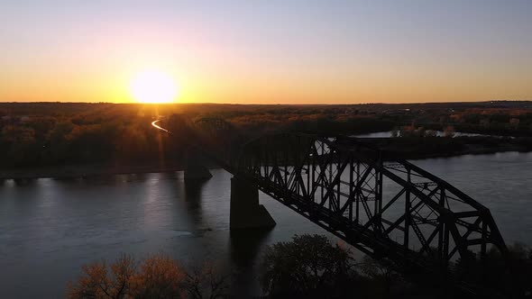 Aerial view of the BNSF Railway Bridge over the Missouri river at sunset alt