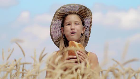 Hungry Child Eating Bread in Wheat Field Summer Outdoor Lifestyle alt
