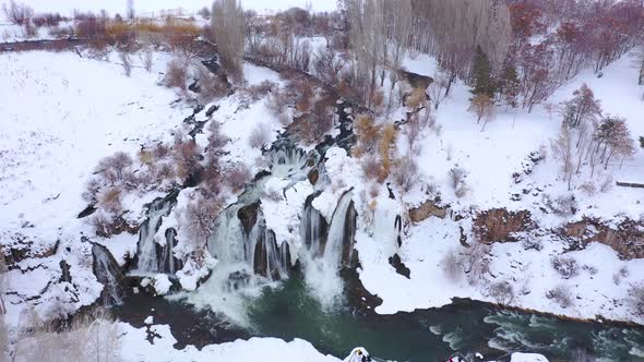 Fantastic view of powerful waterfall falling and hitting water surface inside the beautiful nature alt