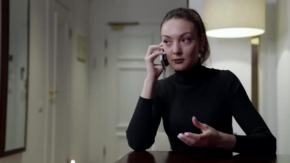 Adult Nervous Woman Is Speaking By Mobile Phone From Home Swearing and Confronting alt