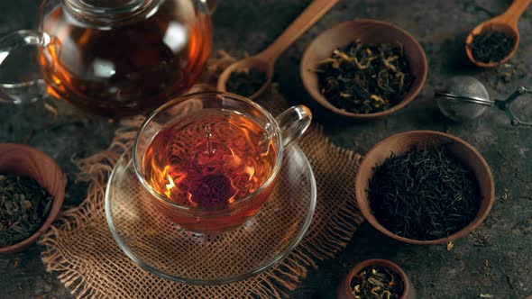 Super Slow Motion Shot of Droplet Falling Into Tea at 1000 Fps with Still Life Background alt