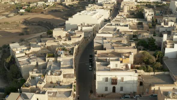Empty Street Going Through Small Mediterranean Village in Developing Country with Brown Beige Sand alt