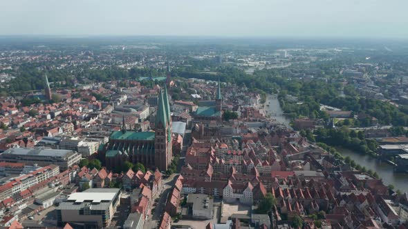 Aerial Panoramic View of Old Town with Red Brick Houses Churches and Buildings alt
