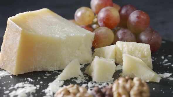 Cheese Plate Closeup with Several Varieties of Fruit and Cheese alt