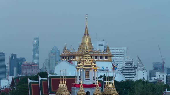 Day to night time lapse of Loha Prasat Wat Ratchanatda and Golden Mountain pagoda, alt