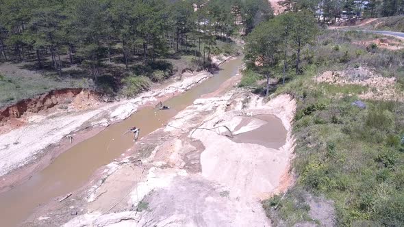 Shallow Narrow Muddy River Used for Sand Mining Upper View alt