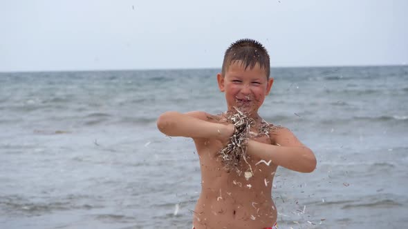 Beach Summer Vacation. Children's Emotions. The Child Develops Tinsel in the Wind. alt