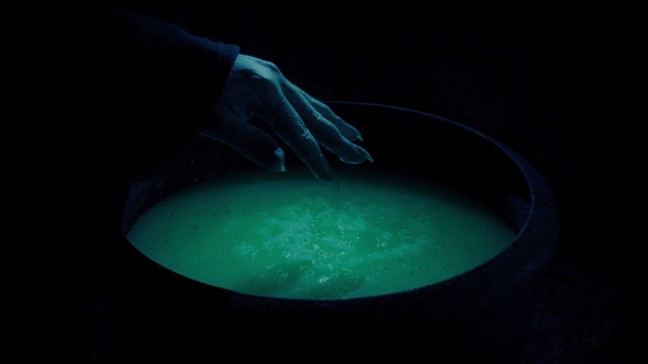 Witch Making Bubbling Brew In Cauldron alt