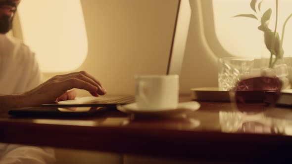 Closeup Hands Typing Keyboard on Airplane Trip alt
