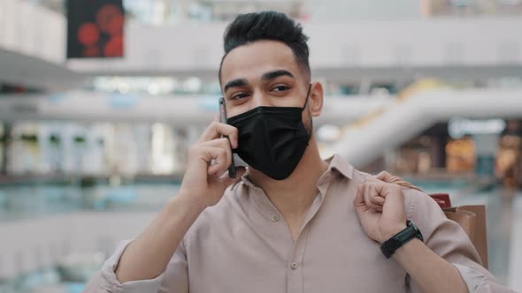 Close Up Happy Arab Young Man Consumer Walking in Mall Portrait Indian Guy in Protective Medical alt
