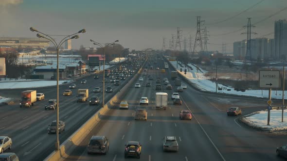 Broadband Big Highway in the Winter. High-voltage Towers Along the Road. alt