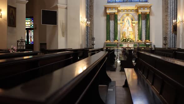 long wooden benches in the catholic church inside