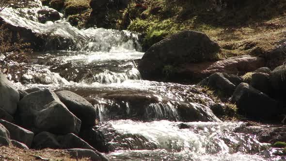 Small Waterfall flowing down Mountain Side in Argentine Patagonia. alt