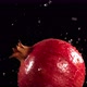 Flying of Pomegranate in Black Background in Slow Motion - VideoHive Item for Sale