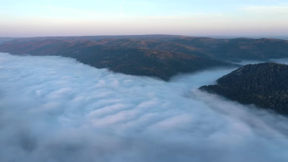Aerial Hyperlapse of Mist Flow in a Mountain Gorge at Dawn alt