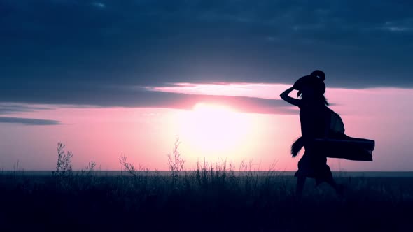 Sorceress with Besom Runs the Rays of the Sun Shine Through the Cloak alt