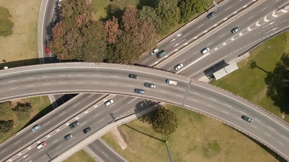 Aerial close up of a highway intersection with traffic at day time in Buenos Aires alt