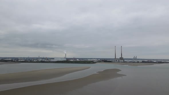 Poolbeg Power Plants And Dublin Bay From Sandymount Strand Beach In Dublin, Ireland. wide shot alt
