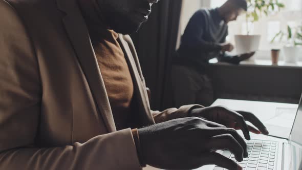 African American Businessman Working on Laptop in Office alt