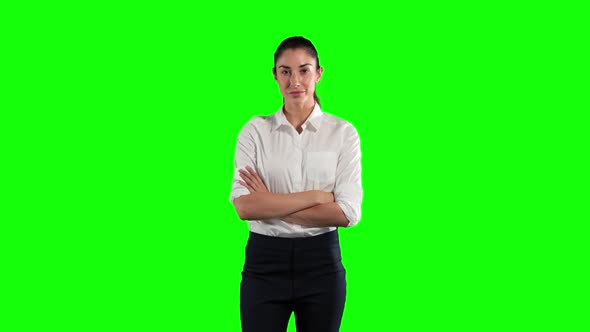 a Caucasian woman in suit in a green background