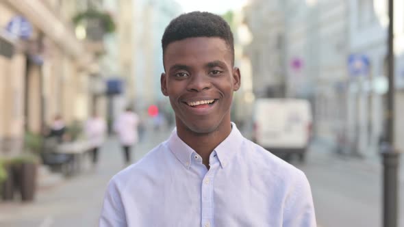 Portrait of African Man Shaking Head As Yes Sign Approval alt