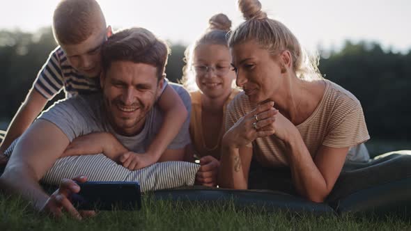 Handheld video of family taking a selfie while holiday. Shot with RED helium camera in 8K alt