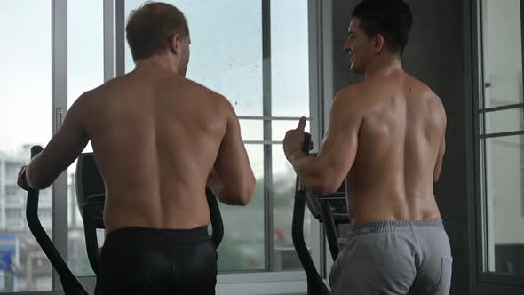 athlete people exercise and training at sport gym, fitness workout with bicycle equipment alt