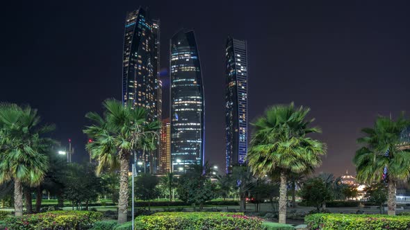 Skyscrapers of Abu Dhabi at Night with Etihad Towers Buildings Timelapse alt