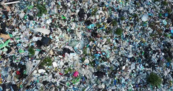 A landfill filled with trash which is not recycled. Aerial drone video alt
