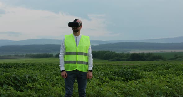 Farm Specialist Engineer Using Technology VR Monitoring Harvest Working for Agriculture Productivity alt