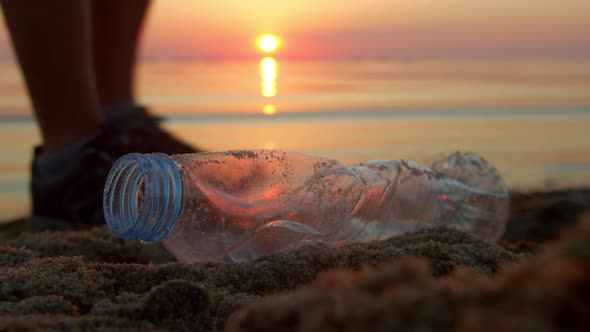 Cleaning Up Plastic Garbage and Various Rubbish on the Sandy Beach alt