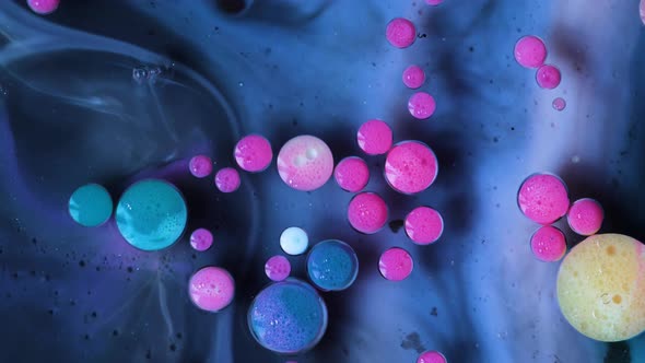 Abstract Acrylic Paint Spread Blast Explode Galaxy. Bright colored bubbles sparkling. alt