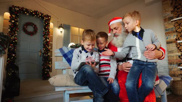 Little Guys Showing Tablet From Father Christmas.
