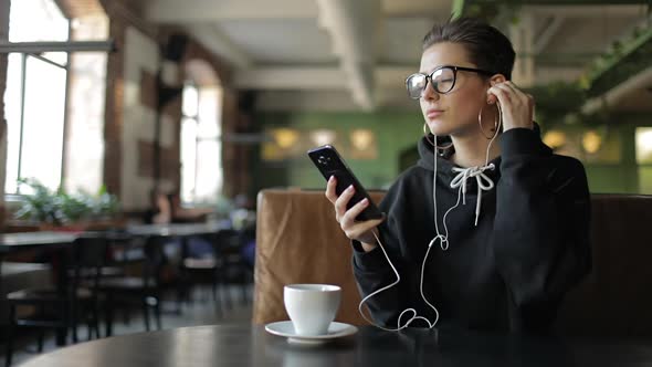 Girl Listening Music on Smartphone alt