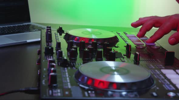 DJ Using His Mixer Table 13
