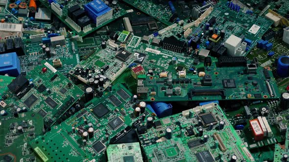 Computer Circuit Boards Pile Moving Shot alt