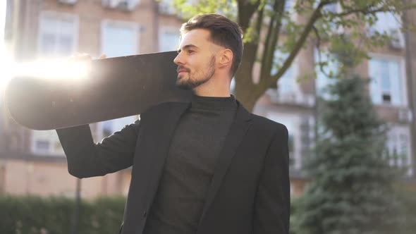 Medium Shot of Confident Young Man Turning Looking at Camera in Sunrays alt