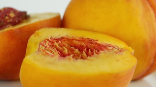Rotation of a juicy peach. 360 degree rotation, extreme close-up. Peach orange juicy tree fruit.