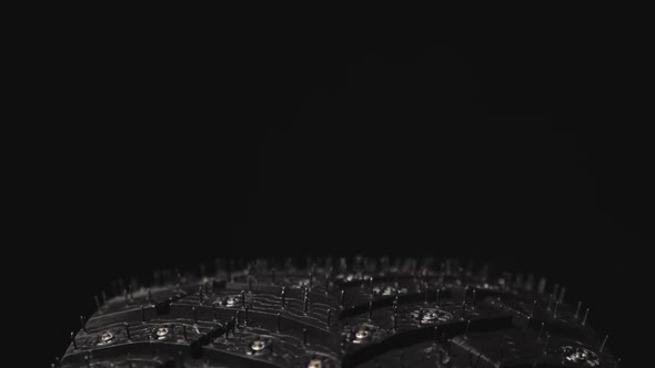 Car Winter Tire with Studded on Black Background alt