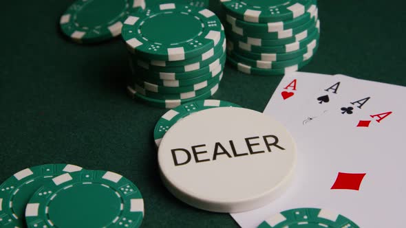 Rotating shot of poker cards and poker chips on a green felt surface - POKER 004 alt