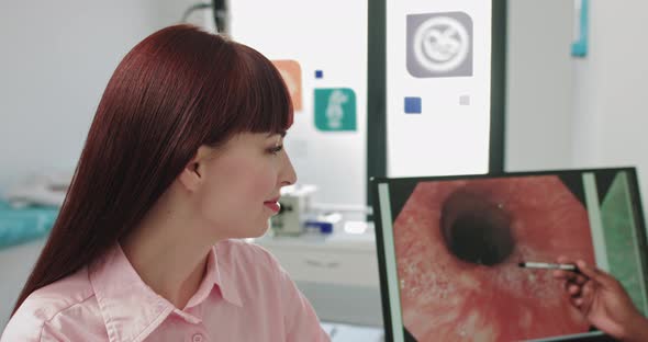 Close Up Portrait of Caucasian Woman Patient Sitting in Hospital Cabinet at alt