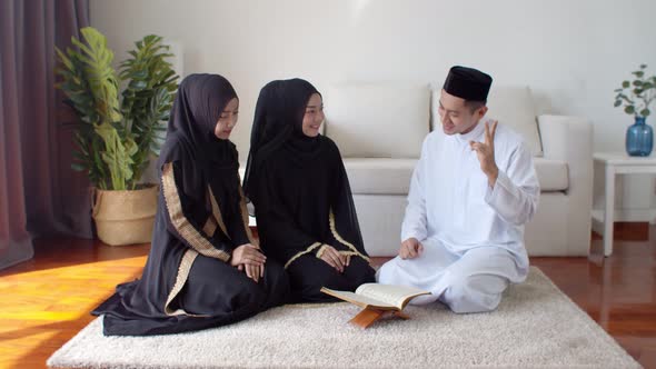 Handsome Muslim man knowledge test about Quran two young women