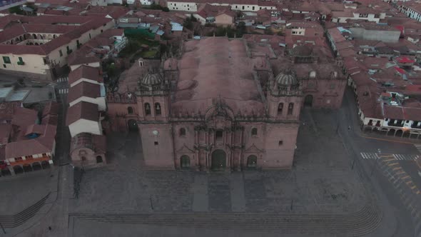 4k daytime aerial drone footage over the main Cathedral from Plaza de Armas in Cusco, Peru during Co alt