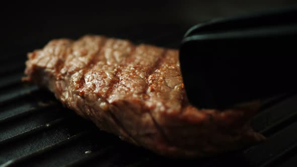 Fresh Beef Meat on Ignited Pan Closeup View