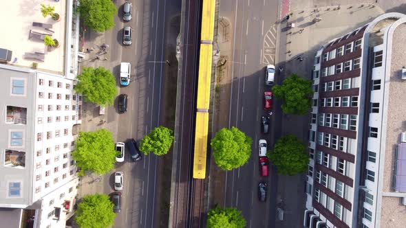 Follow yellow subway train entering Eberswalder Straße station. Wonderful aerial view flight slowly alt