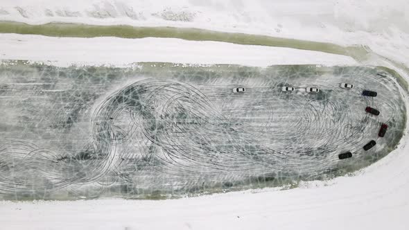 Drone Aerial View of Training Circuit on Frozen Lake with Sport Cars Training on It Before alt