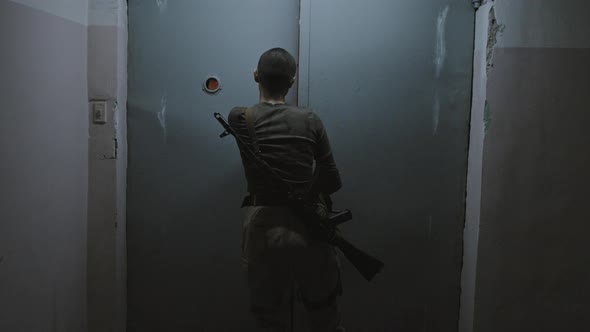 Woman Looking at Zombies Stuck in Elevator alt