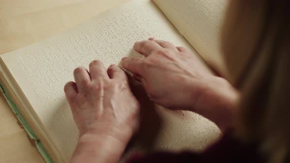 Blind Woman Reading Braille Book Top View Poorly Seeing Female Person Learning to Read Home alt