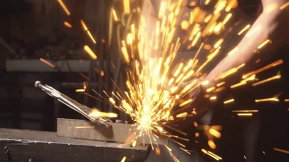 Sparks From Grinder Cutting Metal. Slow Motion
